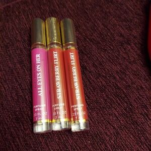 Strawberry flirt and All eyes on her mini perfumes by bath and body works